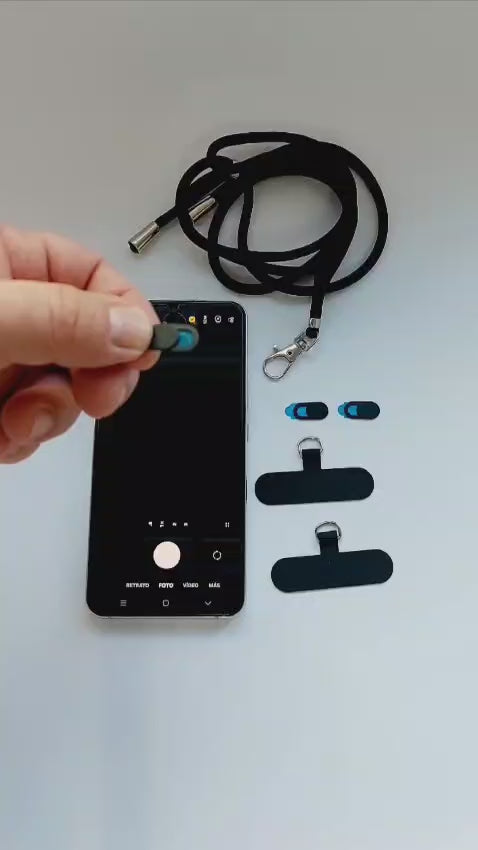 Cargar video: Instalación en segundos. Tapa de cámara + cordón antirrobo para Android.
